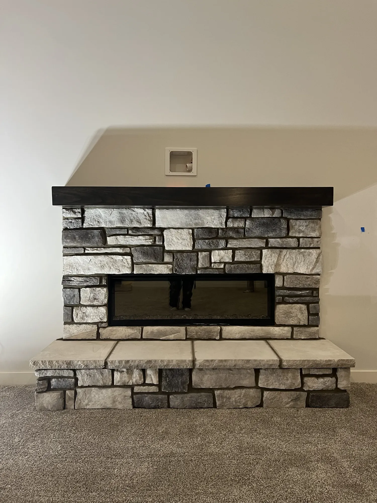 Finished interior stone fireplace